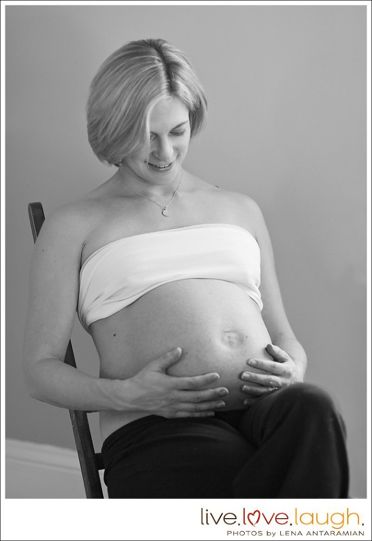 Beautiful pregnant woman is posing for her maternity session